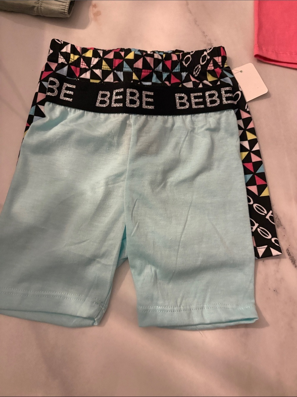 bebe Girls Light Blue Bike Shorts  and Geometric patterned shorts for one price